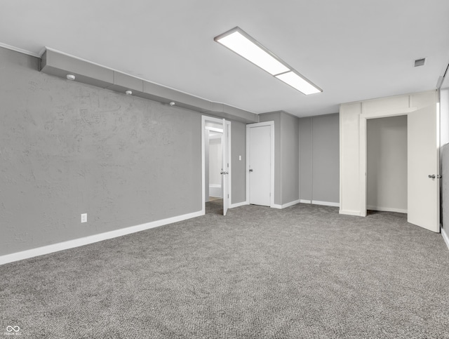finished basement with baseboards and carpet flooring