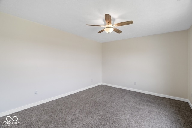6519 Rothchild Blvd, Indianapolis, IN 46278 - spare room with dark carpet, baseboards, and a ceiling fan