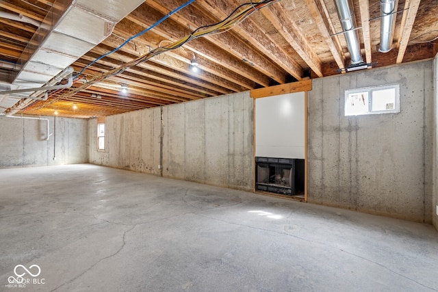 6519 Rothchild Blvd, Indianapolis, IN 46278 - basement with a fireplace and a healthy amount of sunlight