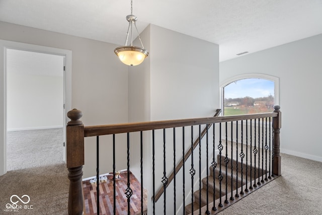 6519 Rothchild Blvd, Indianapolis, IN 46278 - corridor featuring baseboards, carpet flooring, an upstairs landing, and visible vents