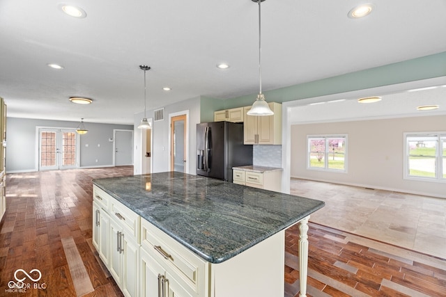 6519 Rothchild Blvd, Indianapolis, IN 46278 - kitchen with recessed lighting, visible vents, open floor plan, and black fridge