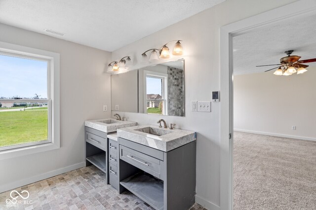 6519 Rothchild Blvd, Indianapolis, IN 46278 - bathroom featuring double vanity, visible vents, baseboards, and a sink