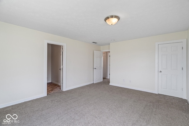 6519 Rothchild Blvd, Indianapolis, IN 46278 - unfurnished bedroom featuring carpet floors and baseboards