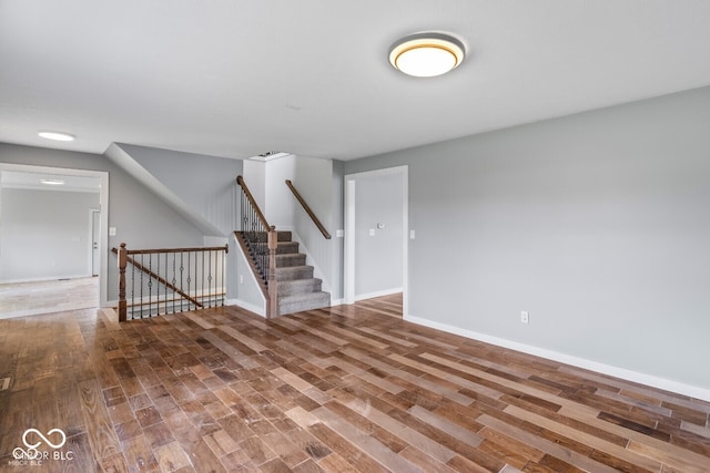 6519 Rothchild Blvd, Indianapolis, IN 46278 - unfurnished living room featuring wood finished floors and baseboards