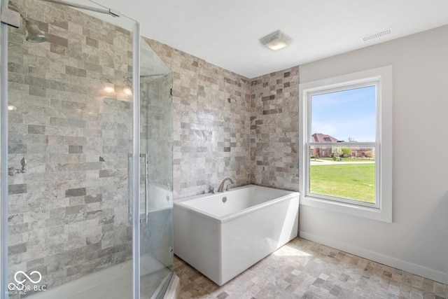 6519 Rothchild Blvd, Indianapolis, IN 46278 - bathroom featuring a freestanding tub, a shower stall, visible vents, and baseboards