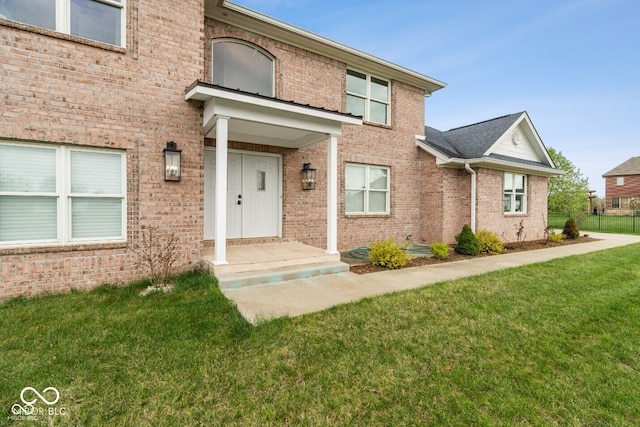 6519 Rothchild Blvd, Indianapolis, IN 46278 - doorway to property with brick siding and a lawn
