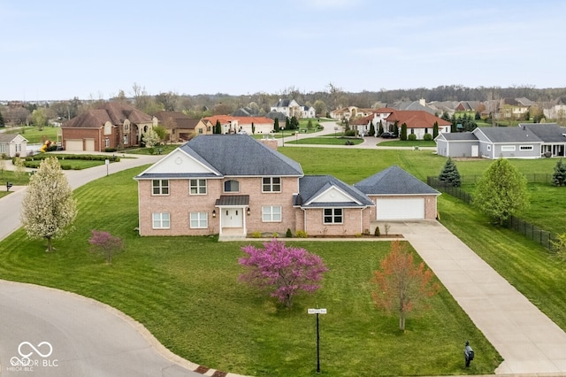 6519 Rothchild Blvd, Indianapolis, IN 46278 - view of front of home with brick siding, a residential view, a front yard, and concrete driveway