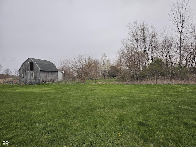 view of yard with an outbuilding and a barn