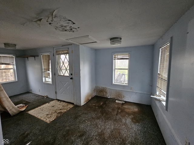 entryway featuring a healthy amount of sunlight and a textured ceiling