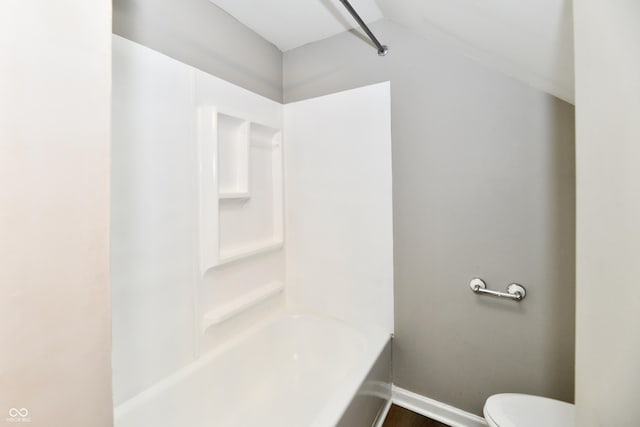 106 S Wayburn St, Indianapolis, IN 46229 - bathroom featuring vaulted ceiling, baseboards, shower / bathtub combination, and toilet