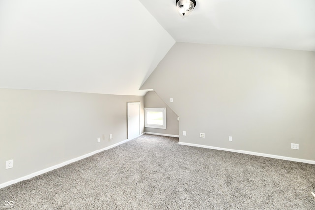 106 S Wayburn St, Indianapolis, IN 46229 - bonus room with lofted ceiling, carpet flooring, and baseboards