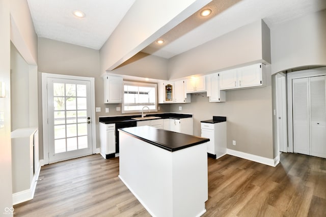 106 S Wayburn St, Indianapolis, IN 46229 - kitchen with white cabinets, a center island, and wood finished floors