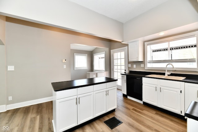 106 S Wayburn St, Indianapolis, IN 46229 - kitchen featuring dishwasher, dark countertops, a sink, and visible vents