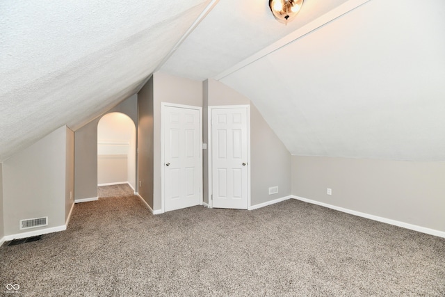 106 S Wayburn St, Indianapolis, IN 46229 - bonus room with lofted ceiling, visible vents, carpet flooring, and baseboards