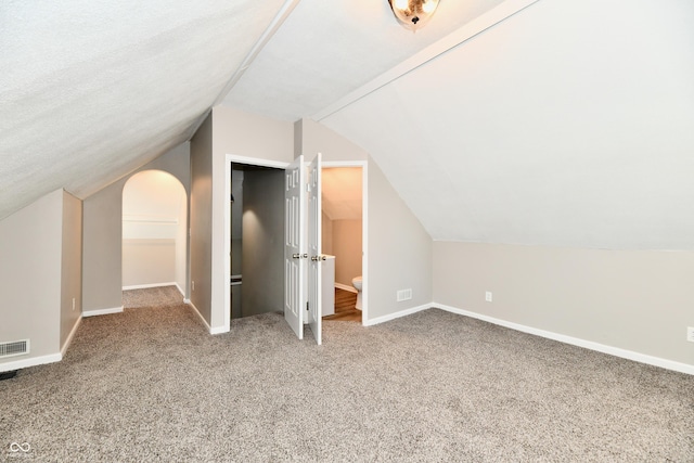 106 S Wayburn St, Indianapolis, IN 46229 - additional living space with vaulted ceiling, carpet, visible vents, and baseboards