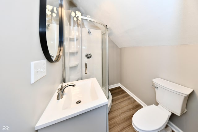 106 S Wayburn St, Indianapolis, IN 46229 - bathroom with baseboards, lofted ceiling, toilet, and a stall shower
