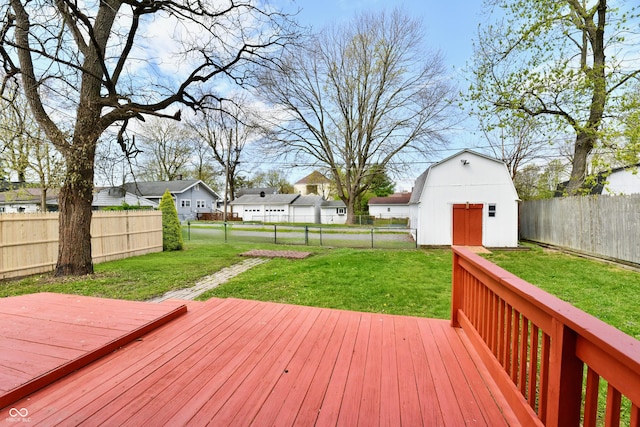 106 S Wayburn St, Indianapolis, IN 46229 - deck with a yard, an outbuilding, a fenced backyard, and a residential view