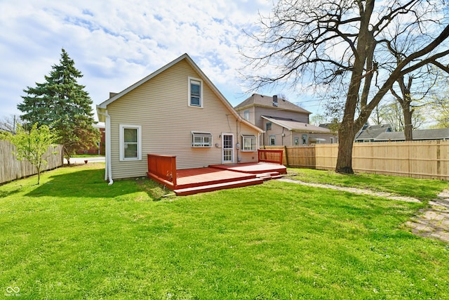106 S Wayburn St, Indianapolis, IN 46229 - back of property with a yard, a fenced backyard, and a deck