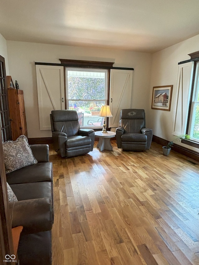 living area featuring wood finished floors and baseboards
