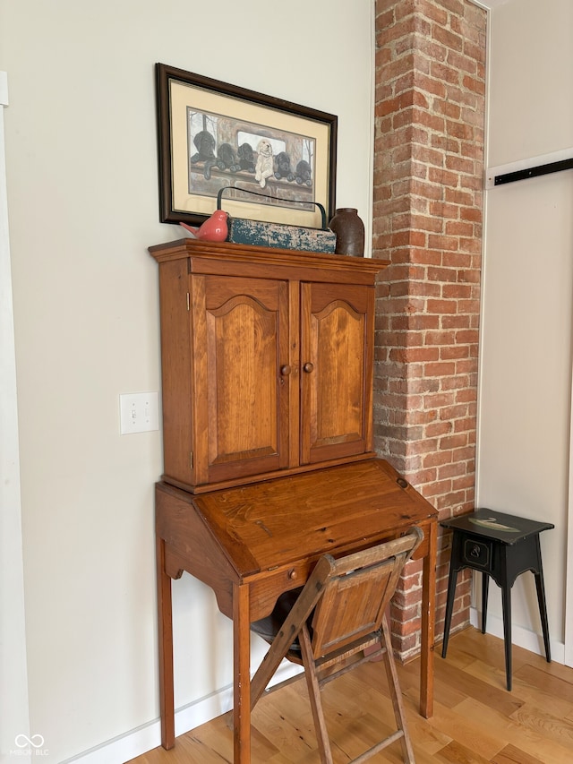 details featuring baseboards and wood finished floors