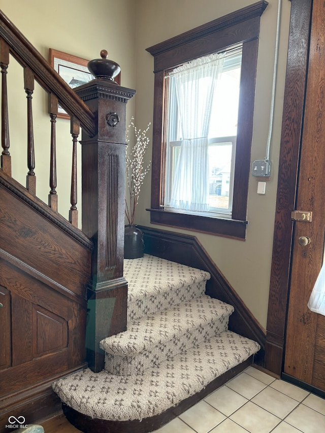 stairs featuring tile patterned floors