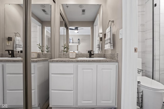 full bathroom featuring a ceiling fan, toilet, visible vents, and vanity