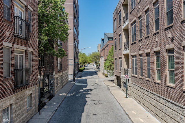 view of street with a residential view and street lights