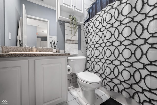 full bath with toilet, tile patterned floors, ornamental molding, and vanity
