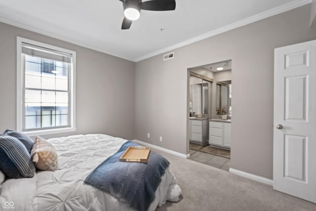 bedroom with crown molding, carpet floors, baseboards, and visible vents