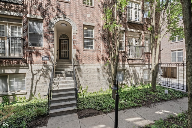 entrance to property with brick siding