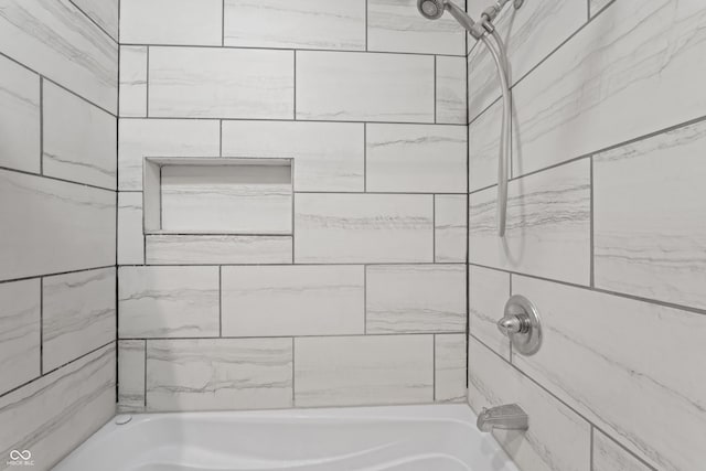 full bath featuring shower / washtub combination