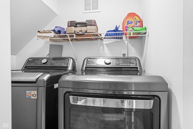 laundry room with laundry area, independent washer and dryer, and visible vents