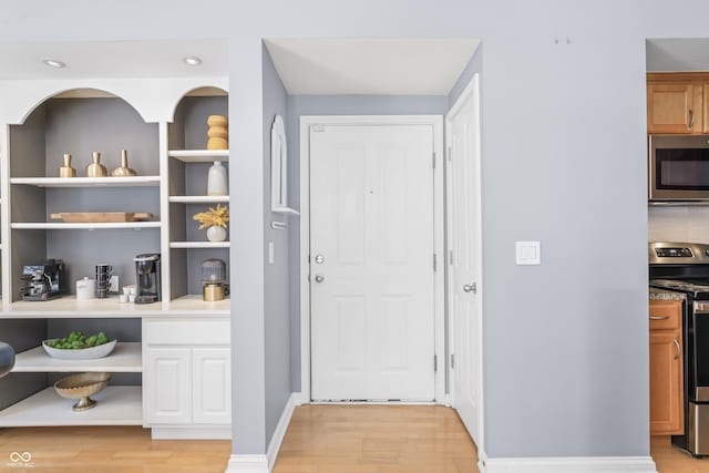 interior space with recessed lighting and light wood-style flooring