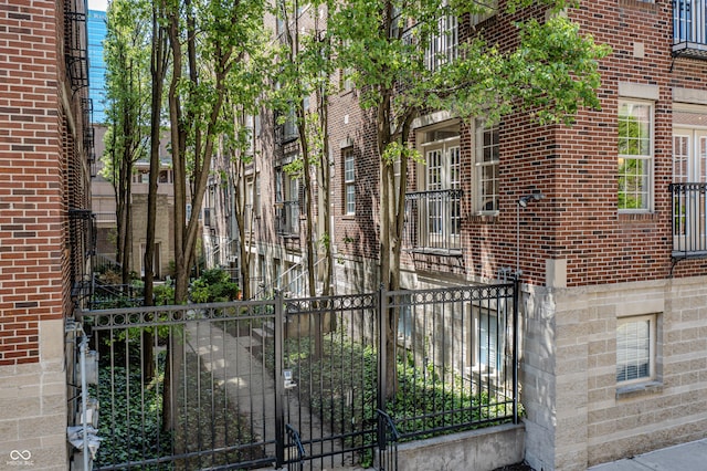 view of gate featuring fence