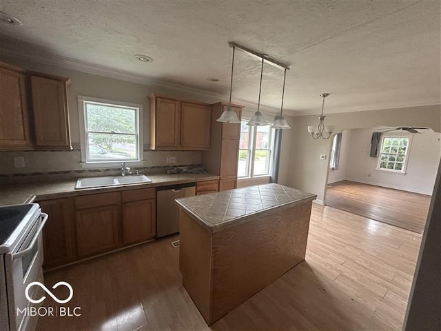 1640 Lawton Ave, Columbus, IN 47201 - kitchen featuring dishwasher, crown molding, electric range, a textured ceiling, and a center island