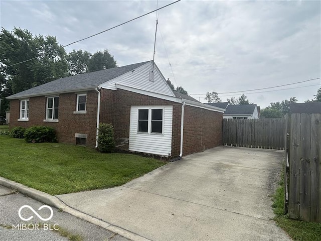 1640 Lawton Ave, Columbus, IN 47201 - view of side of home with brick siding and concrete driveway