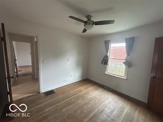 1640 Lawton Ave, Columbus, IN 47201 - unfurnished bedroom with wood finished floors and a ceiling fan
