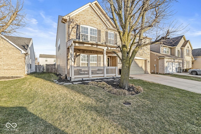 traditional-style house with a porch, a front yard, a garage, driveway, and fence