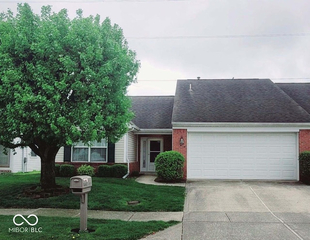 view of front of house featuring an attached garage, a shingled roof, brick siding, and concrete driveway