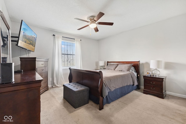 4464 Four Seasons Cir, Indianapolis, IN 46226 - bedroom with baseboards, a ceiling fan, and light carpet