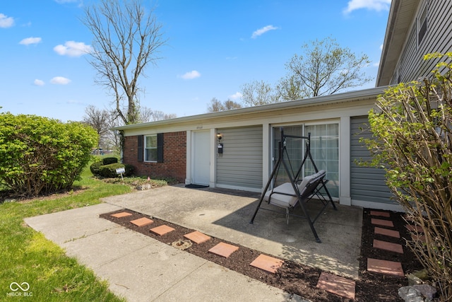 4464 Four Seasons Cir, Indianapolis, IN 46226 - exterior space featuring brick siding and a patio