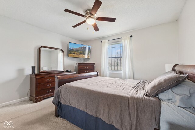 4464 Four Seasons Cir, Indianapolis, IN 46226 - bedroom with light colored carpet, baseboards, and a ceiling fan