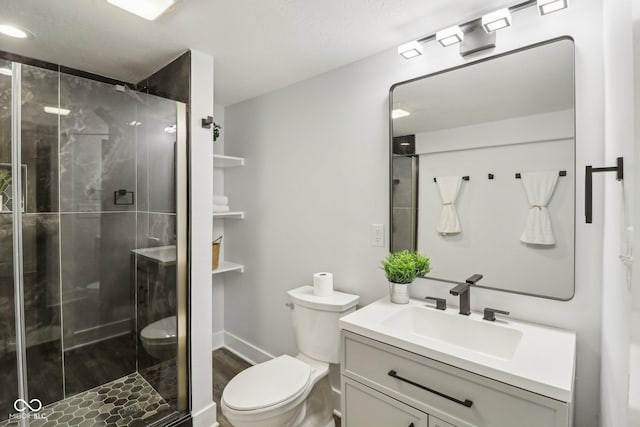 625 N Temple Ave, Indianapolis, IN 46201 - bathroom with toilet, vanity, a stall shower, and wood finished floors