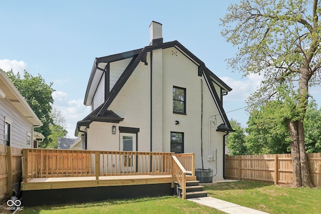 625 N Temple Ave, Indianapolis, IN 46201 - back of house featuring a wooden deck, brick siding, and a chimney
