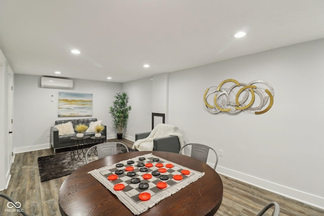 625 N Temple Ave, Indianapolis, IN 46201 - dining space with a wall mounted AC, recessed lighting, wood finished floors, and baseboards