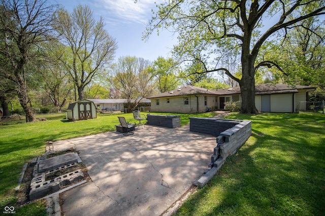 4710 E 56th St, Indianapolis, IN 46220 - view of patio / terrace with a storage unit and an outbuilding