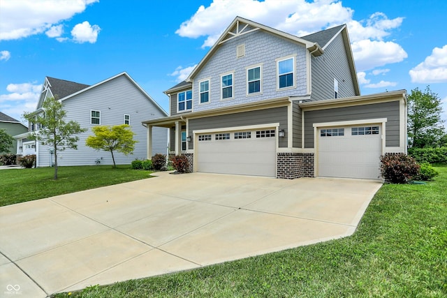 13567 Moorcroft Dr, Fishers, IN 46037 - craftsman-style house featuring concrete driveway, a front lawn, a garage, and brick siding