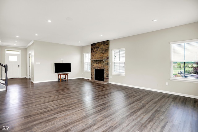 13567 Moorcroft Dr, Fishers, IN 46037 - unfurnished living room featuring healthy amount of natural light, stairs, dark wood-style flooring, and recessed lighting