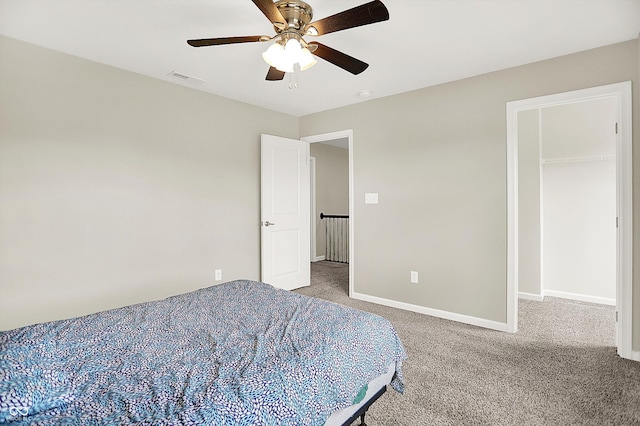 13567 Moorcroft Dr, Fishers, IN 46037 - bedroom featuring carpet floors, baseboards, a ceiling fan, and a spacious closet
