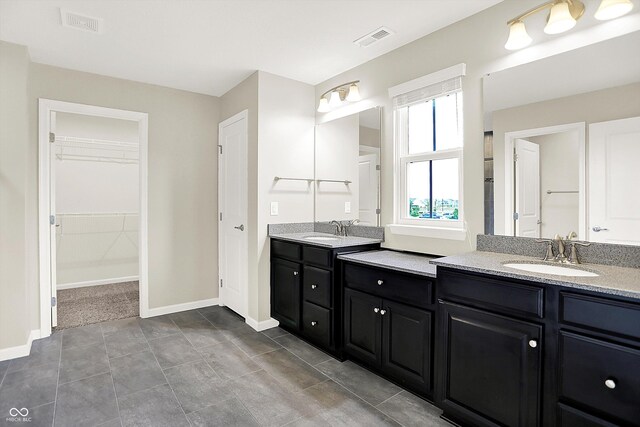 13567 Moorcroft Dr, Fishers, IN 46037 - bathroom featuring vanity, a spacious closet, and baseboards